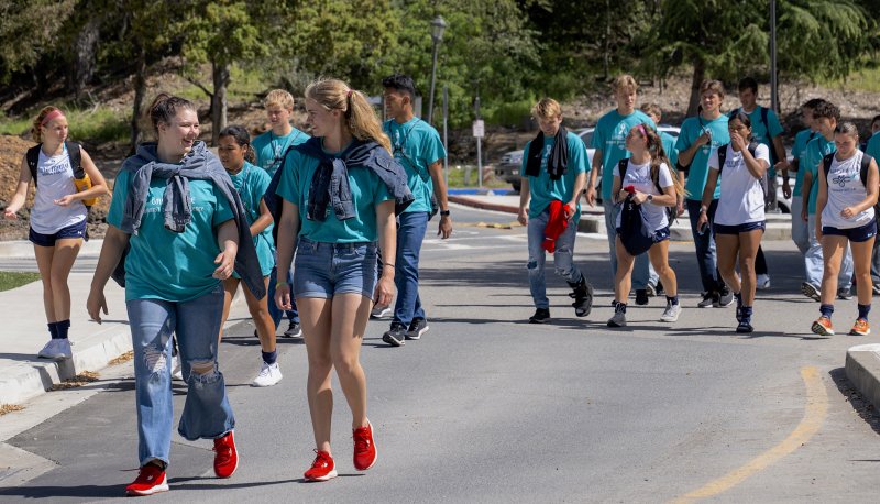 Saint Mary's students wearing denim and teal T-shirts for Denim Mile in April 2023