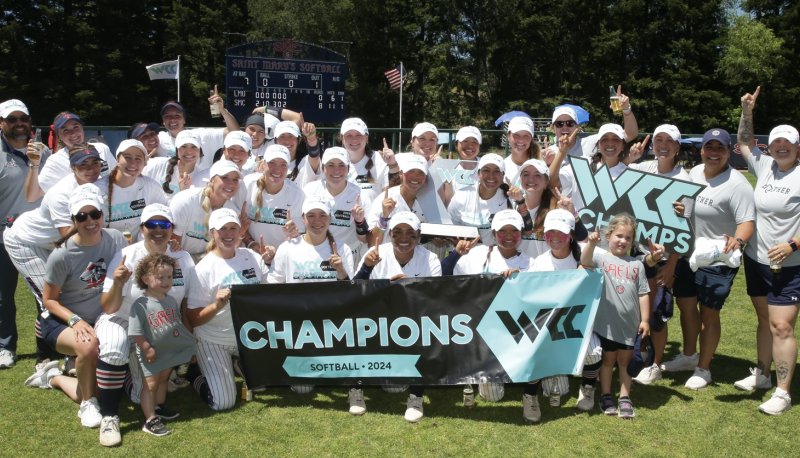 Saint Mary's softball team holding up the West Coast Conference Champions banner