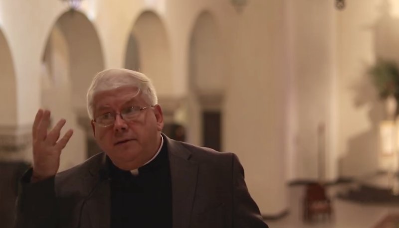 Father David Gentry-Akin in a church