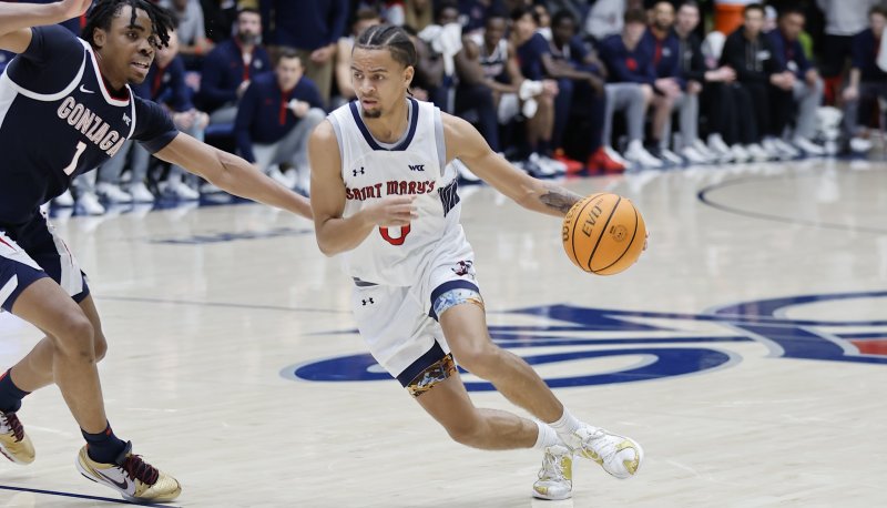 Men's basketball player Mikey Lewis drives against Gonzaga on February 1, 2025