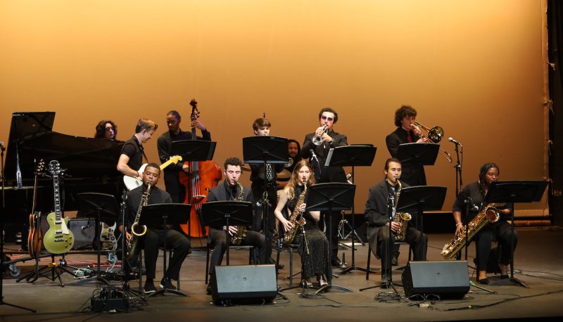 SMC Jazz Band performing on stage dressed in formal black.