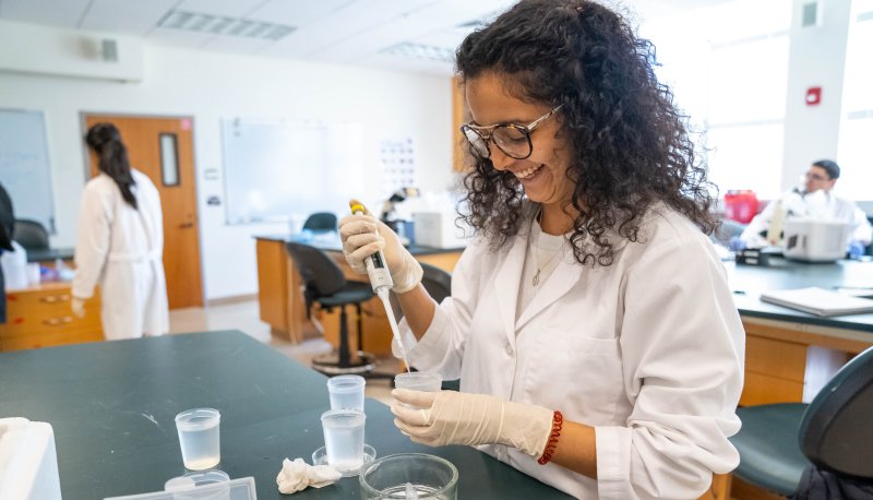 A student studying embryonic development in a lab