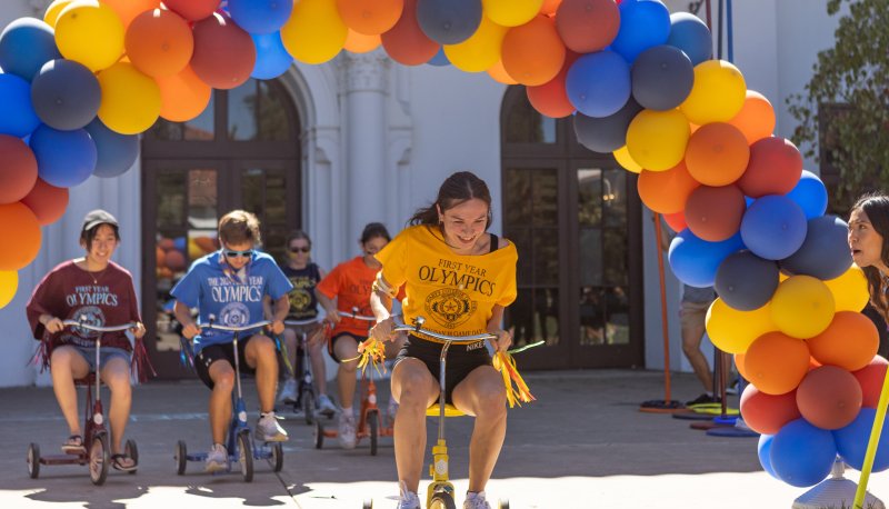 Paola Quintero ‘29, representing De La Salle hall in the lead during the tricycle race at the First Year olympic event on Sept 14, 2025. / Photo by Rebecca Harper