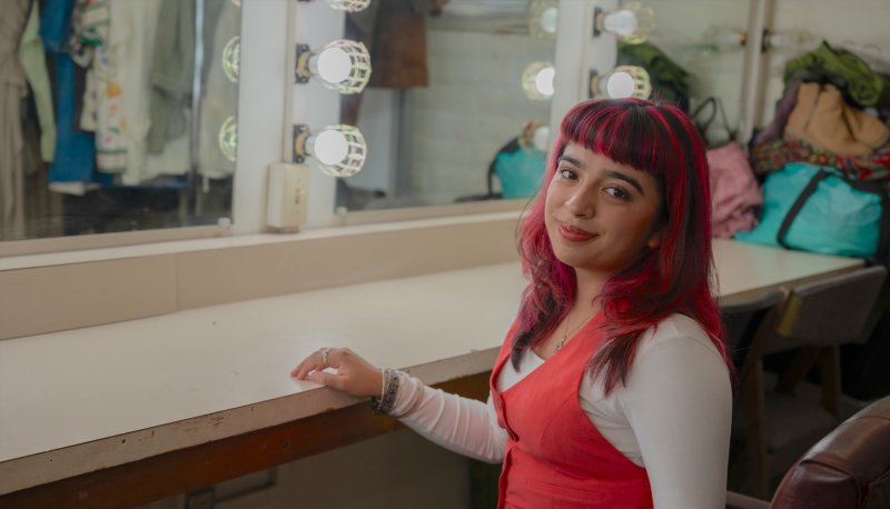 Bianca Langlois '27 posing in green room at LeFevre Theatre