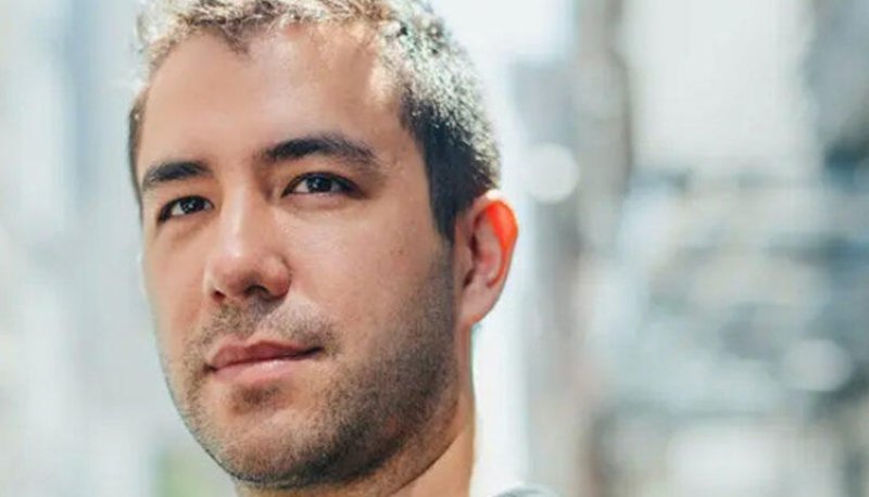 a headshot of a young playwright Christopher Chen with a black Tshirt