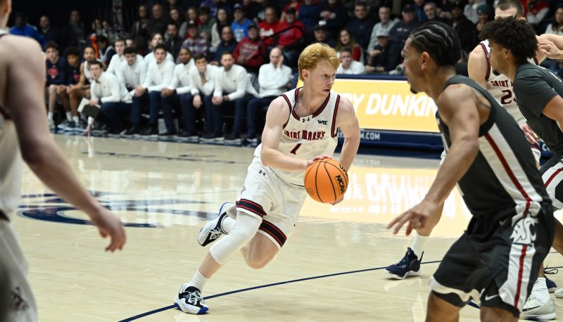 Basketball player Joshua Dent drives against WSU in January 2026
