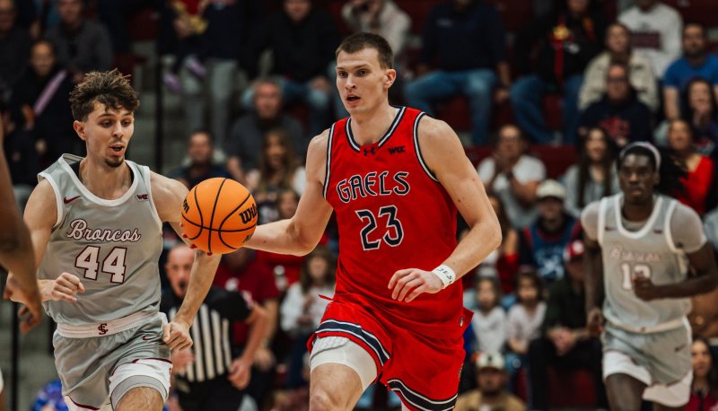 Basketball player Paulius Murauskas drives against Santa Clara in January 2026