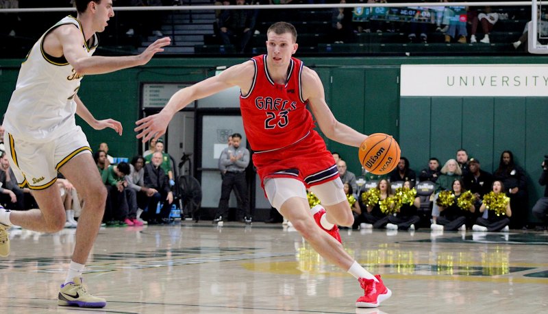 Basketball player Paulius Murauskas drives against USF in January 2026