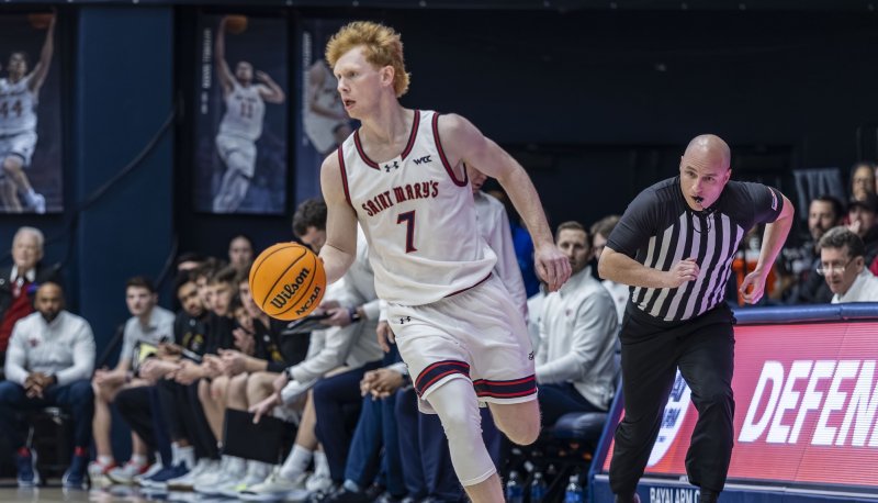 Basketball player Joshua Dent drives against OSU in January 2026