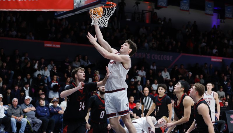 Basketball player Harry Wessels shoots against Seattle in January 2026