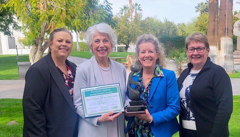 Pamela Stanley, Maria O'Rourke, Nancy Loos, and Theresa Murphy with awards for Maria O'Rourke in February 2026
