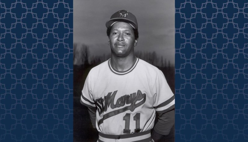 Baseball Coach Miles McAfee with a blue patterned background