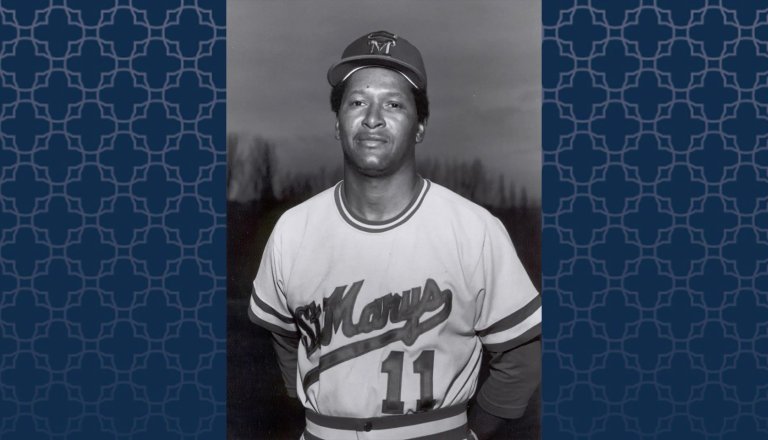 Baseball Coach Miles McAfee with a blue patterned background