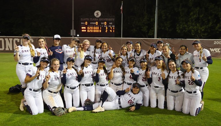 Softball team holding up index fingers to mark winning WCC title at Santa Clara in May 2026