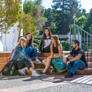 Student talk on campus steps