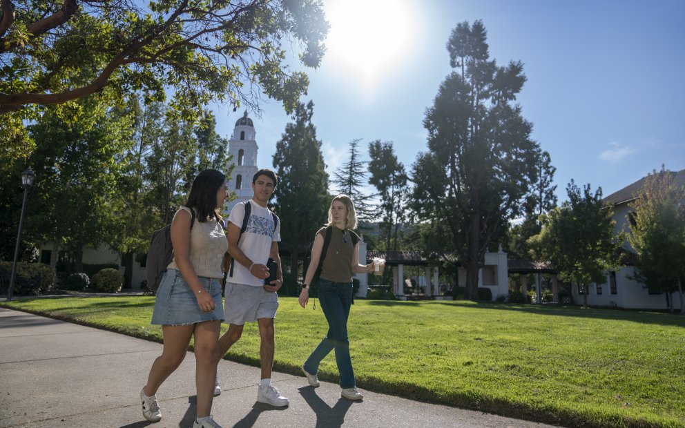 3 students walking in front of Chapel on Saint Mary's campus