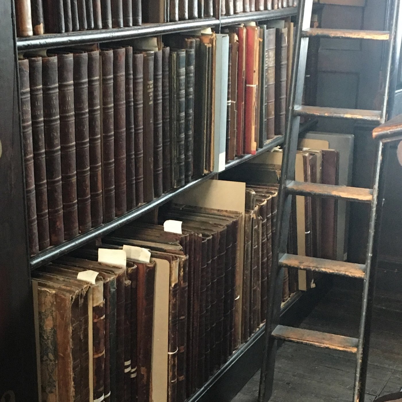 Shelves of old books in a library