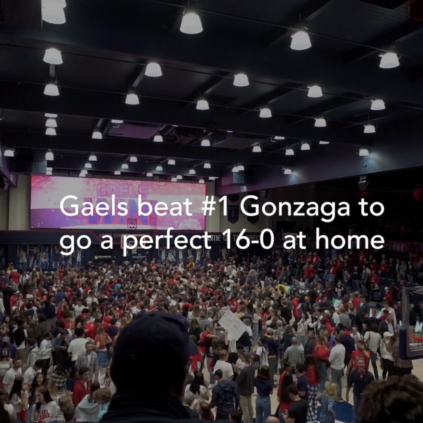 The text Gaels Beat #1 Gonzaga to go a perfect 16-0 at home over a crowd cheering
