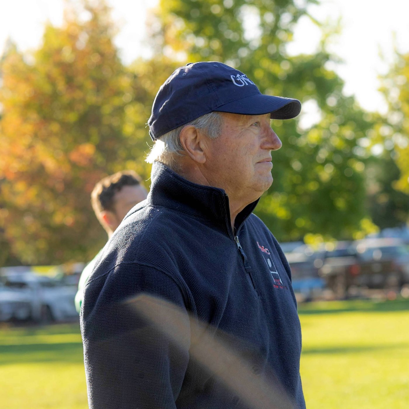 Tom Oneto '65 in profile on a field - honoree for 2023 Pat Vincent Men's Rugby Dinner