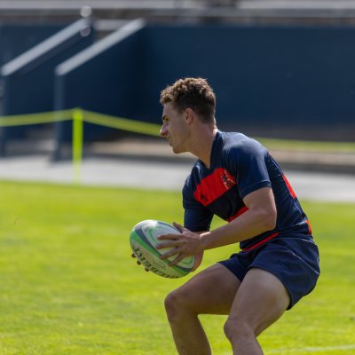 A Saint Mary's rugby player holding the ball