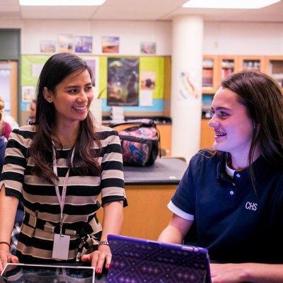 A teacher with students in a classroom