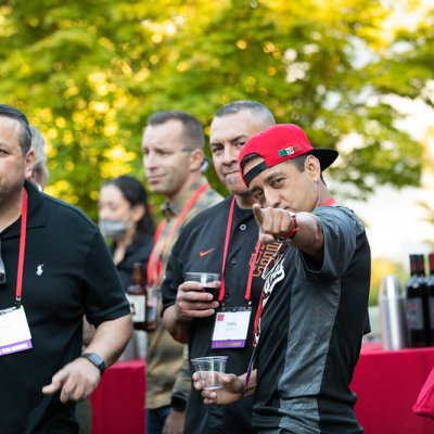 A man playfully points at the camera