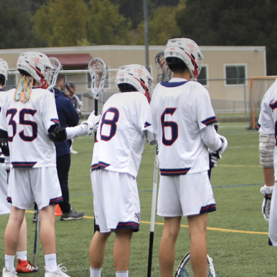 Men's lacrosse players standing in a line