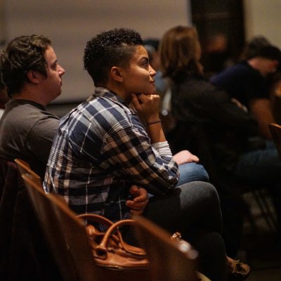 A student watches a craft talk.