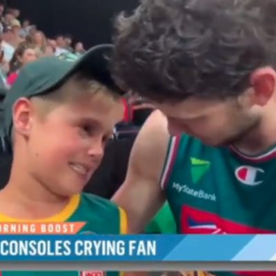 Saint Mary's alum Clint Steindl consoles a young fan after Steindl's Tasmania JackJumpers lost in the NBL semifinals.