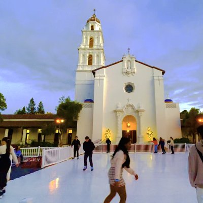 Students ice skating in front of the Saint Mary's Chapel at the 2023 Winter Fest