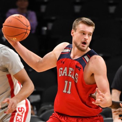 Men's basketball player Mitchell Saxen drives against UNLV in December 2023