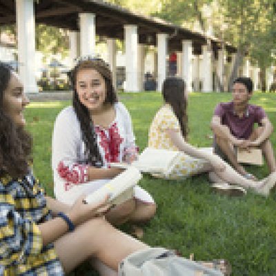 students sitting on the lawn at SMC