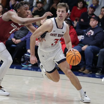 Men's basketball player Augustas Marciulionis drives against Santa Clara in January 2024