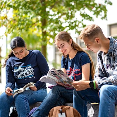 Students standing together in a group smiling on Saint Mary's College Campus