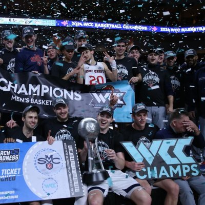 Men's Basketball Team with WCC trophy