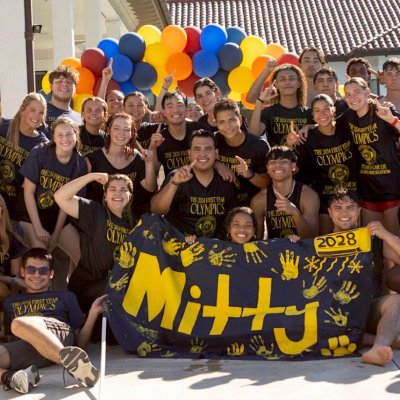 Residents of Mitty Hall posing by pool after winning 2024 First Year Olympics