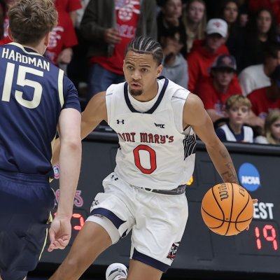 Men's Basketball Player Mikey Lewis drives against Akron on November 12, 2024