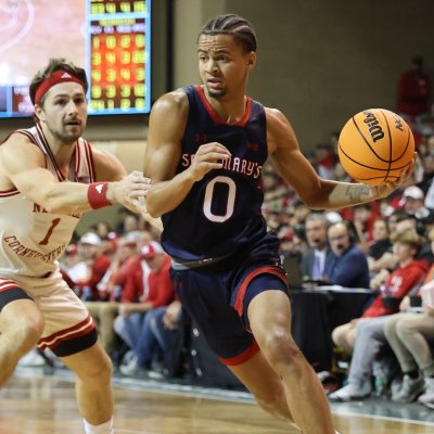 Men's Basketball Player Mikey Lewis drives against Nebraska on November 17, 2024