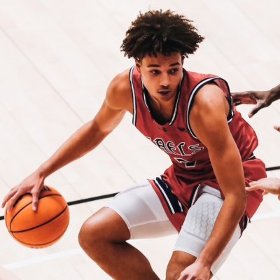 Men's basketball player Jordan Ross dribbles against Portland in January 2025