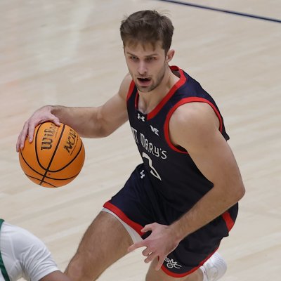 Men's basketball player Augustas Marciulionis drives against USF