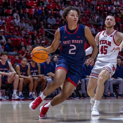 Men's Basketball player Jordan Ross drives against Utah in December 2024