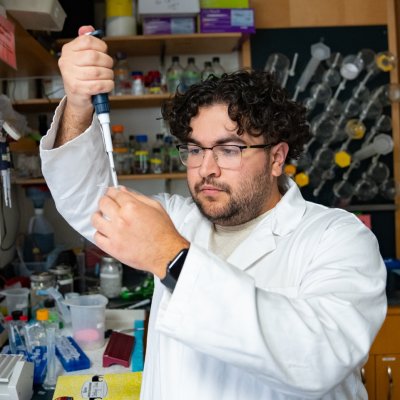 Sharbel AbouBechera '25 pipetting in a Saint Mary's lab