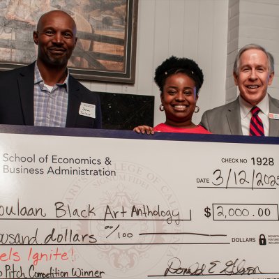 Winner of Gaels Ignite 2025 competition with dean and judge