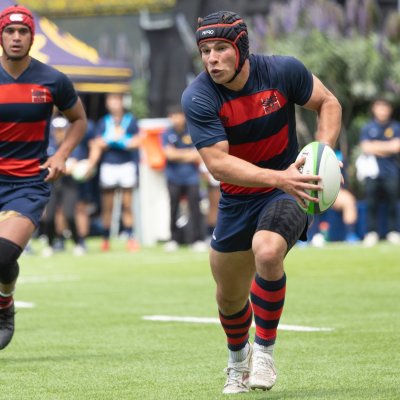 Rugby player Dom Besag '26 carries ball against Cal in semifinals in April 2025
