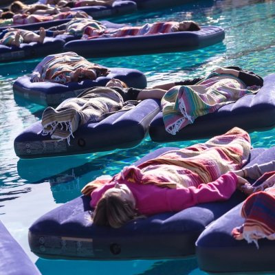 Students float in the pool at the Joseph L. Alioto Recreation Center as part of a Sound Healing Bath in 2025