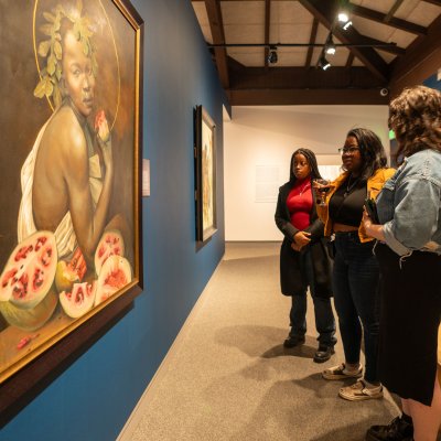 Art Preservation students looking at a painting