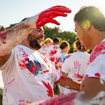 Two students embrace during Paint the SMC in 2024