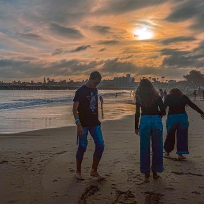 Three students on the beach at Santa Cruz in October 2025