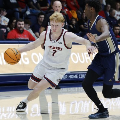 Men's basketball player Joshua Dent drives against UC Merced in November 2025