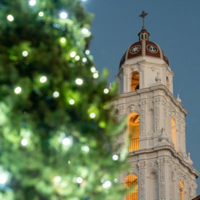 Holiday tree in lights with SMC chapel tower in background